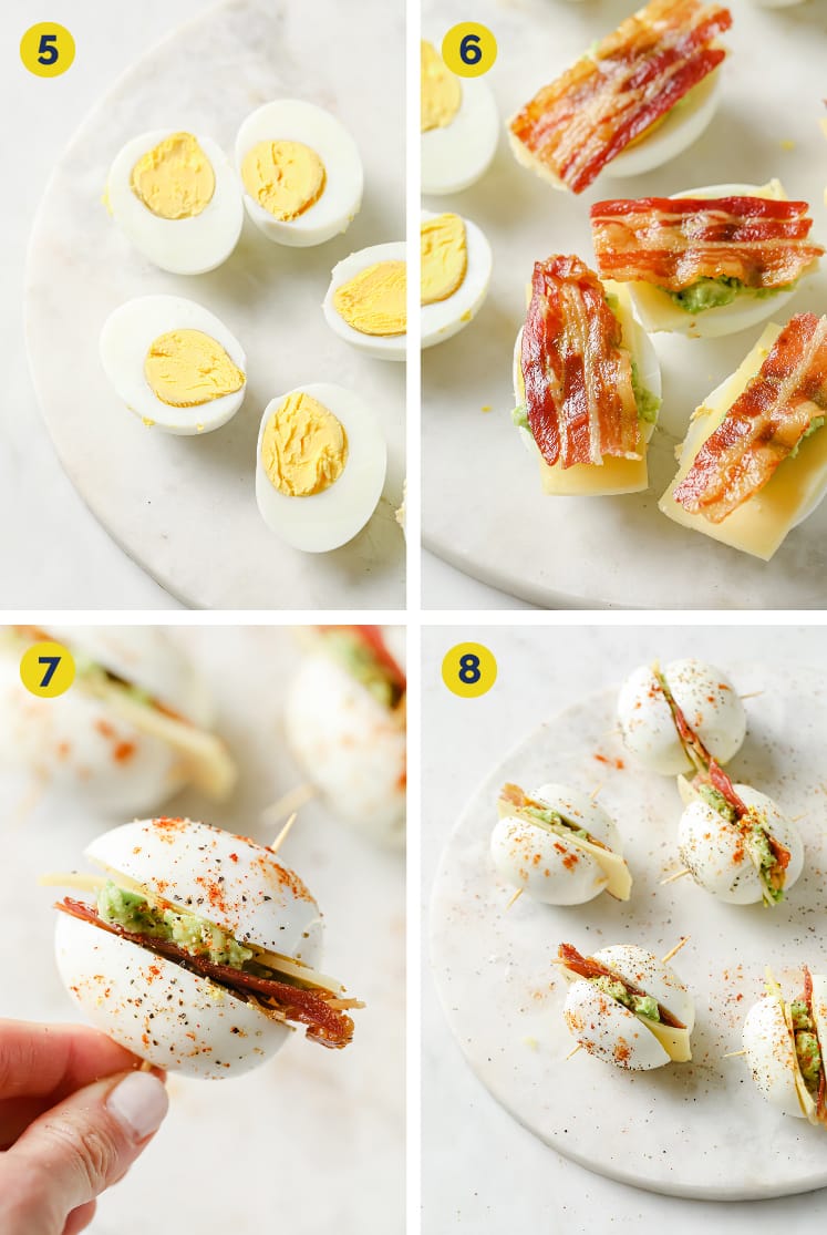 Collage shots of the Breakfast Egg Sliders recipe (steps 5 to 8) · Upper left photo: Overhead shot of sliced eggs on a marble plate atop a marble countertop. · Upper right photo: Overhead shot of sliced eggs with some eggs topped with cheddar, mashed avocado, and bacon on a marble plate atop a marble countertop. · Lower left photo: Close-up shot of one breakfast egg slider held over a marble plate with the remaining breakfast egg sliders. The breakfast egg sliders are skewered with a toothpick and garnished with paprika, freshly cracked pepper, and salt. · Lower right photo: Overhead close-up shot of breakfast egg sliders skewered with a toothpick and garnished with paprika, freshly cracked pepper, and salt on a marble plate atop a marble countertop.