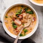 Keto Zuppa Toscana in bowls, one with a spoon.