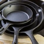 A stack of cast iron skillets.
