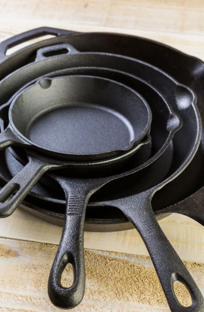 A stack of cast iron skillets.