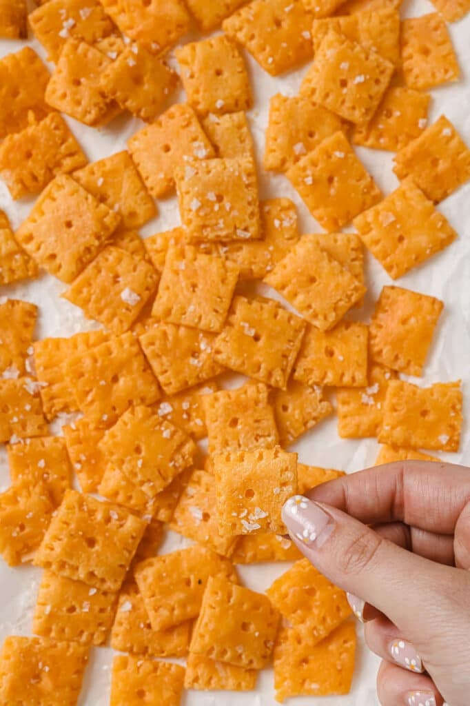Gluten-free Cheez-Its on a parchment paper-lined baking sheet.