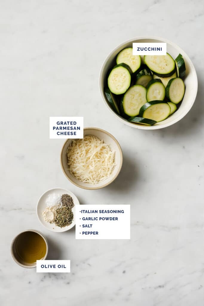 Labeled ingredients for the baked zucchini slices recipe.