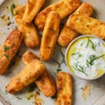 A plate of halloumi fries with a dip.