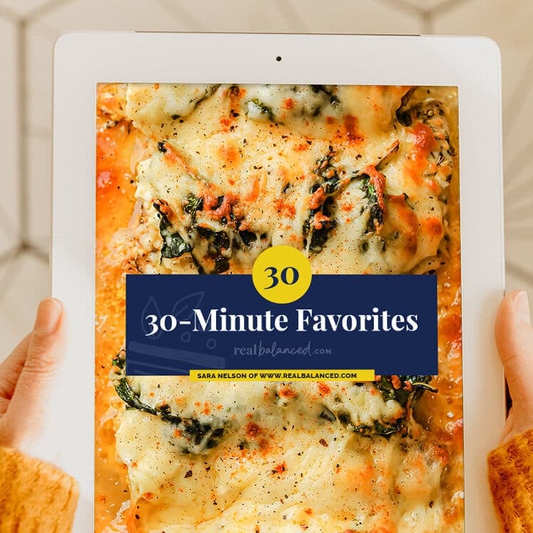 A person holding an iPad with the title 30-Minute Favorites.