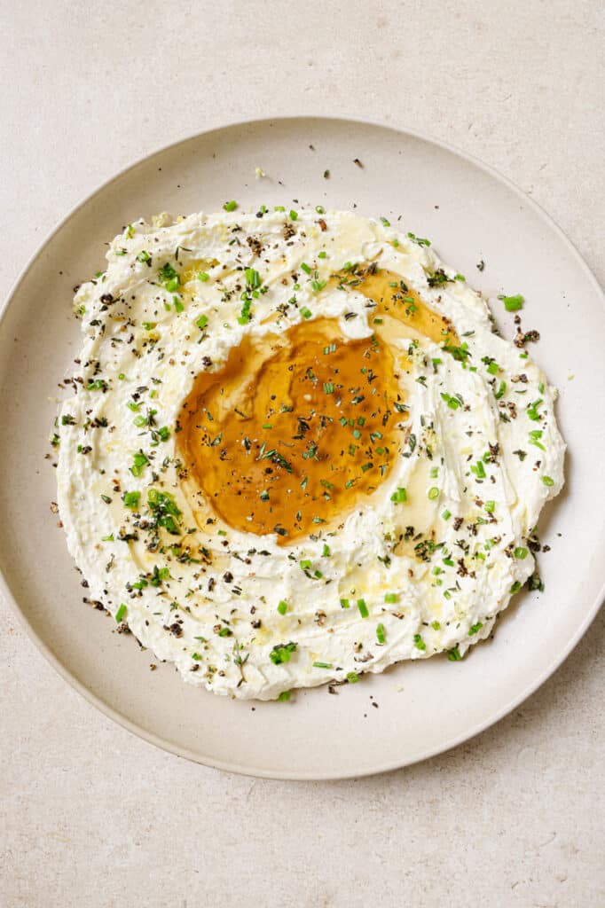 Whipped feta with honey on a plate.