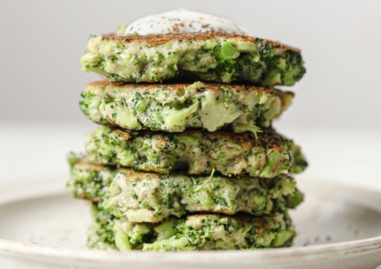 A stack of broccoli fritters on a plate.