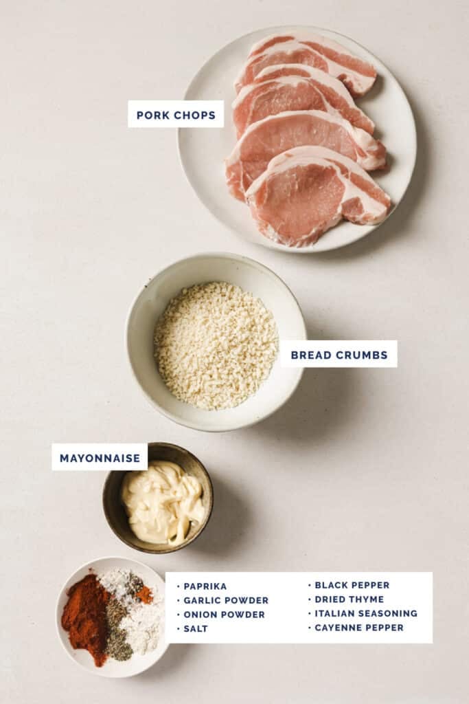Labeled ingredients for shake and bake pork chops on a cream table.