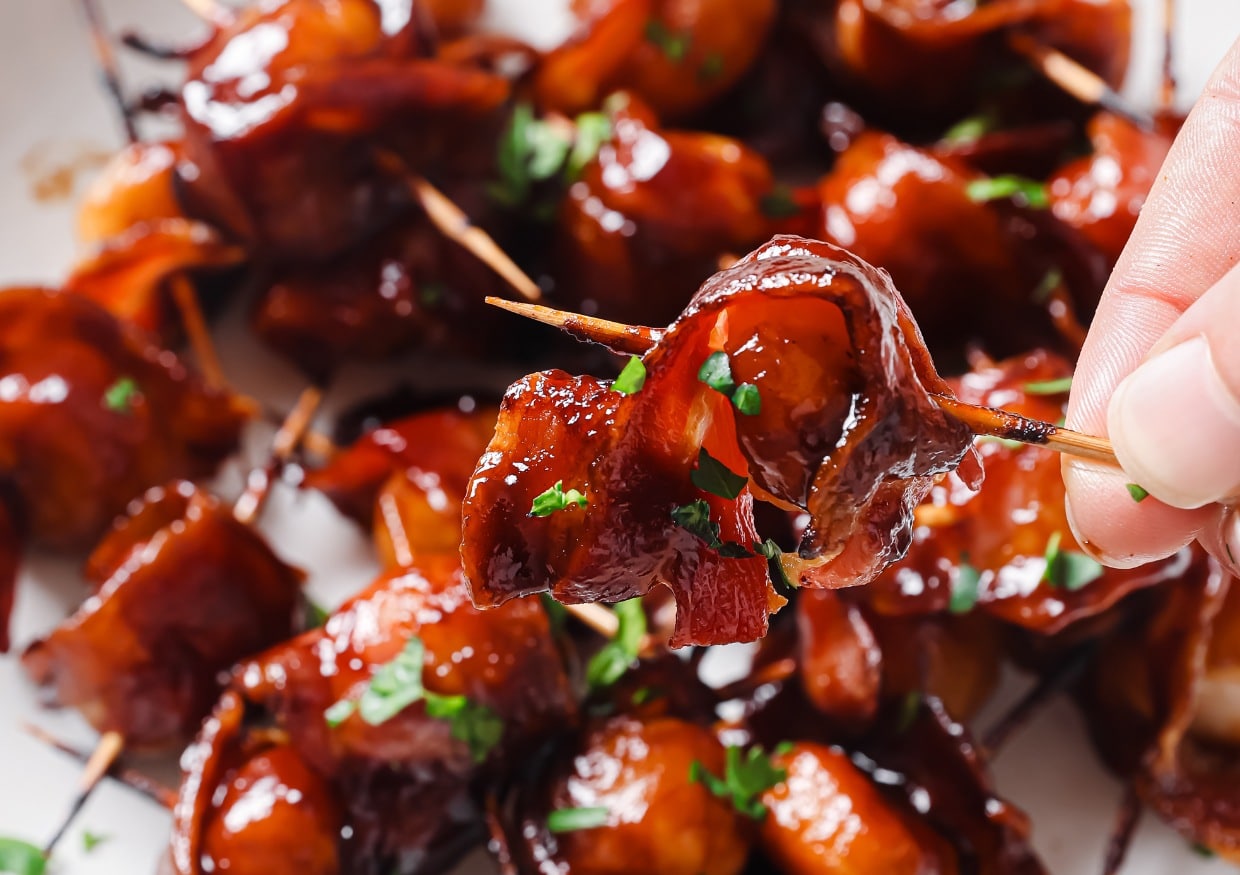 Bacon-wrapped water chestnuts on a plate.