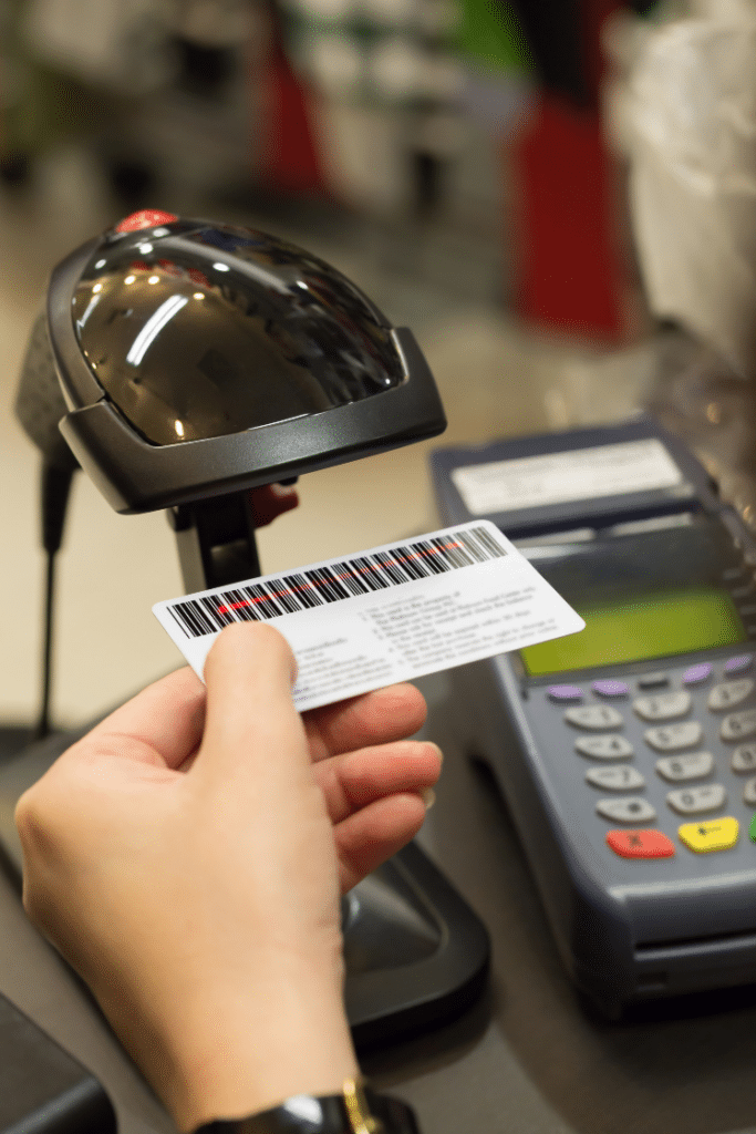 Credit card under a barcode scanner.