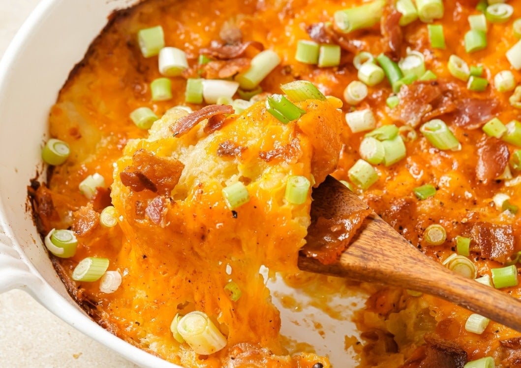 Twice baked potato casserole with bacon and green onions.