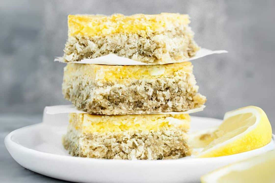 A stack of keto lemon bars on a plate.