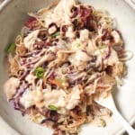 A Reuben bowl with a fork.