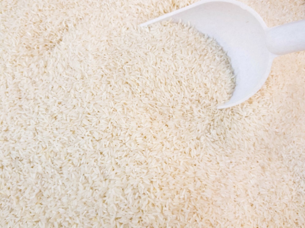 Bulk rice with a scooper.