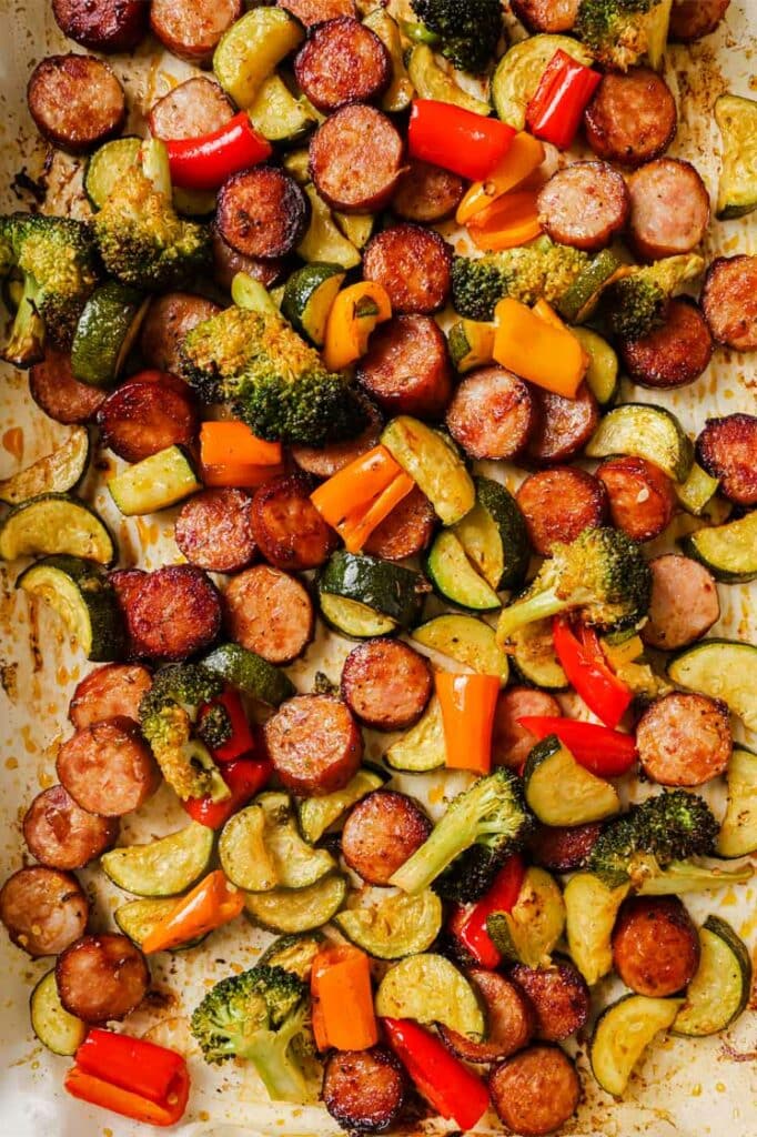 Sausage and veggies sheet pan dinner on a baking sheet.
