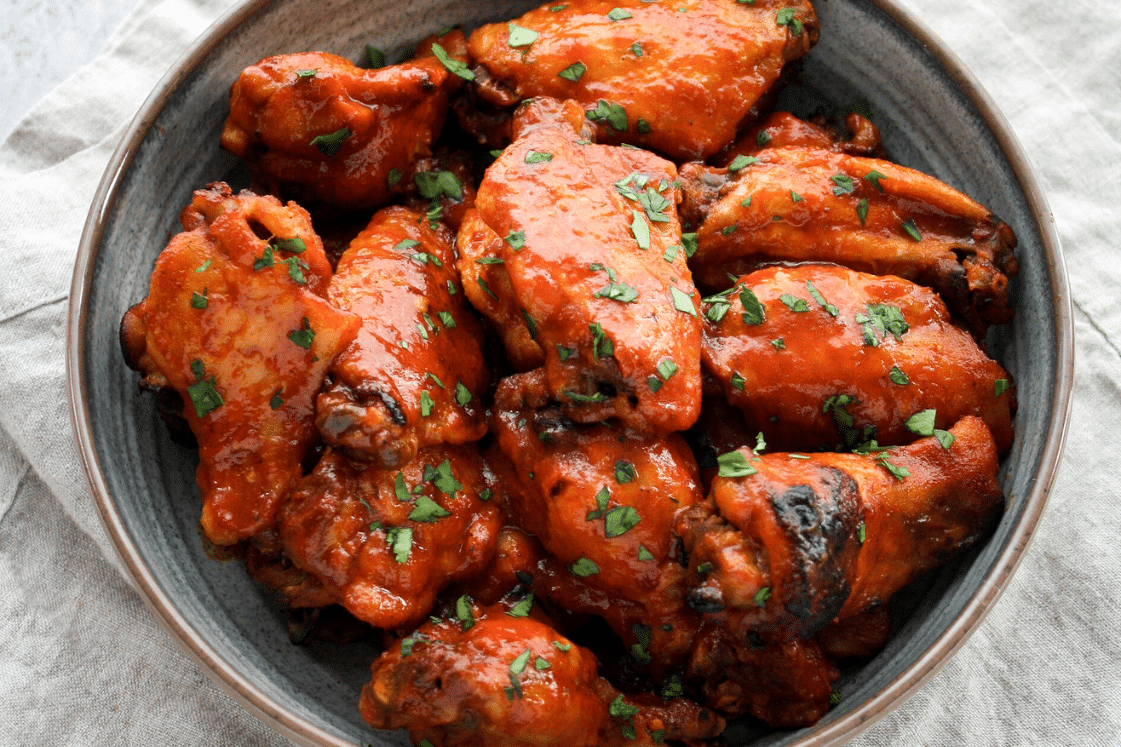 Instant Pot sweet & spicy barbecue chicken wings in a bowl.