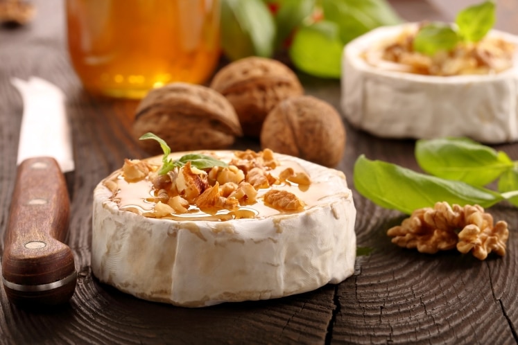 Brie with honey and nuts on top.