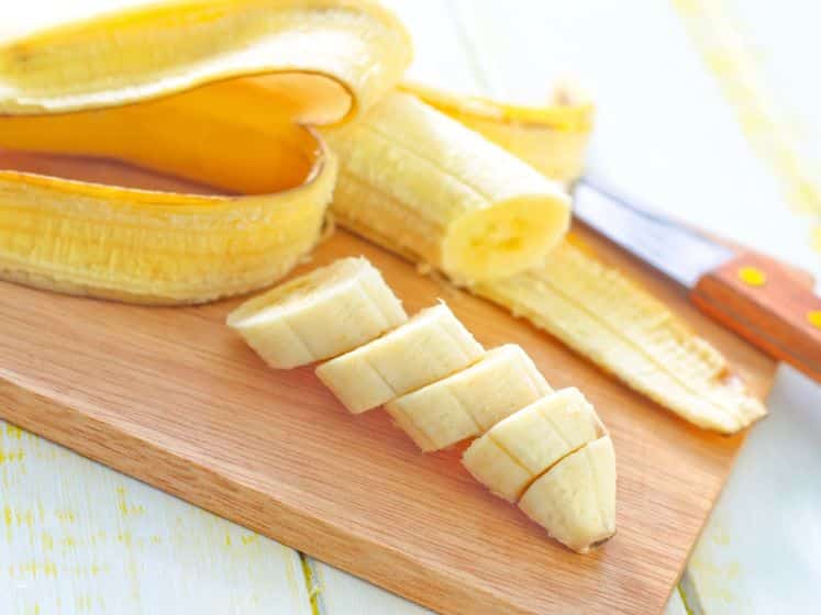 Sliced banana on a chopping board