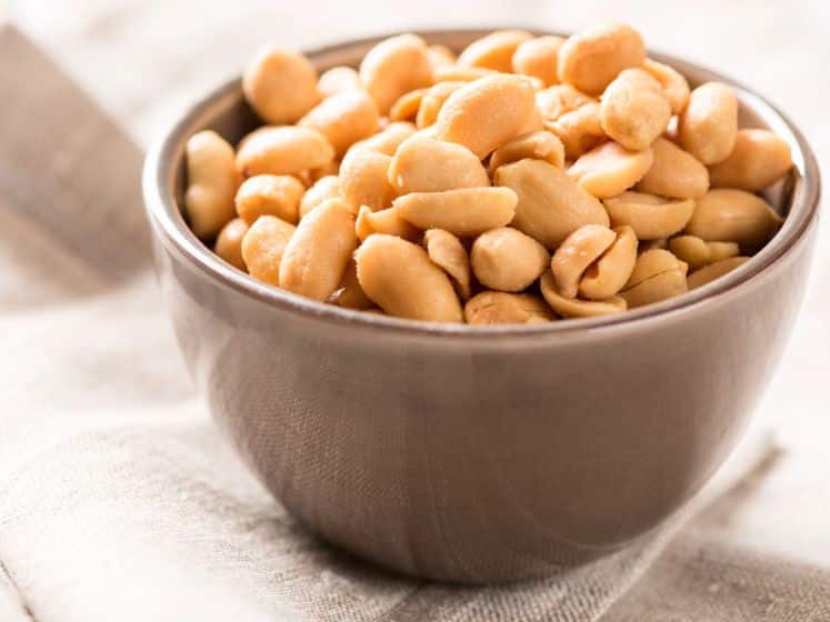 Peanuts in a bowl on tablecloth square