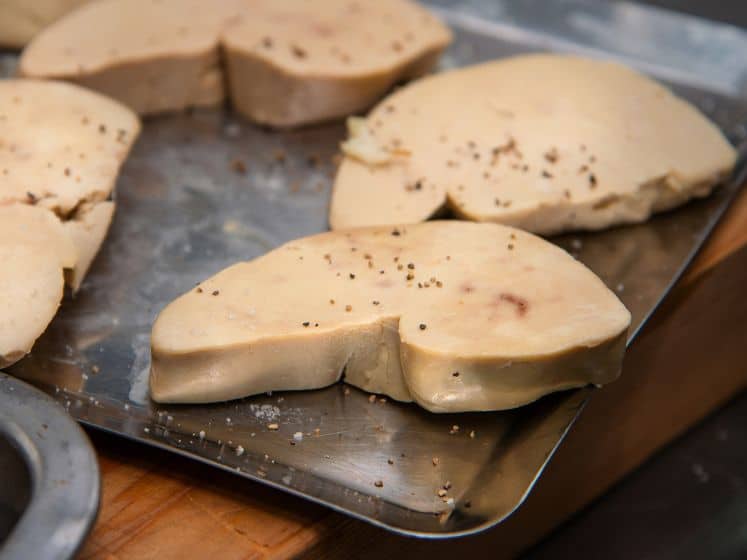 Foie gras sprinkle with pepper prepare to cook in kitchen