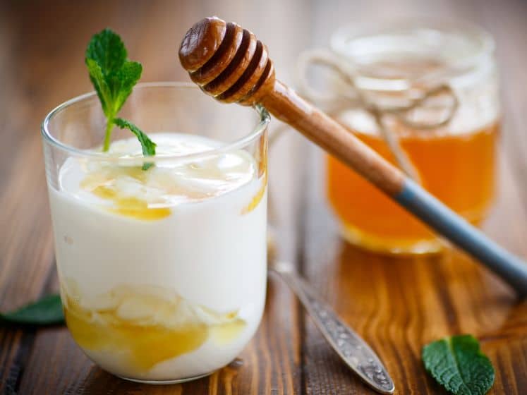Greek yogurt with honey in a glass