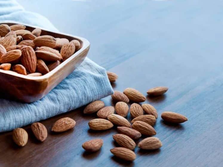 Almonds in small wooden bowl