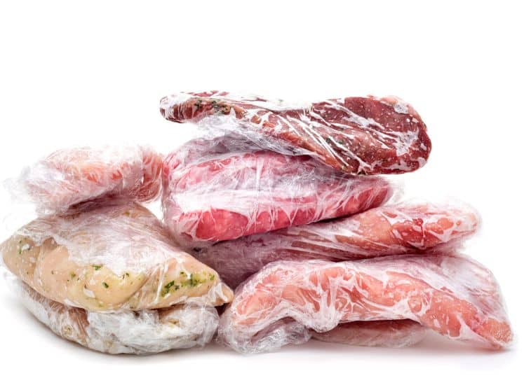 Raw meat wrapped in plastic wrap.