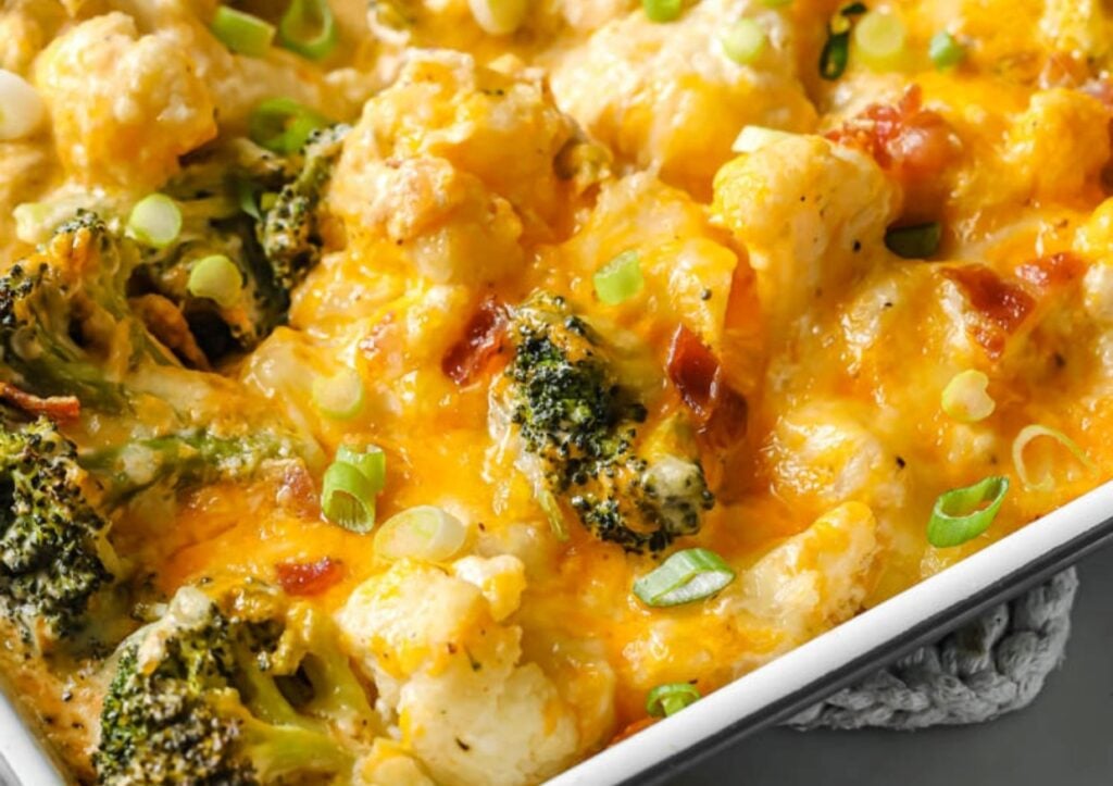 Loaded broccoli cauliflower casserole in a baking pan.