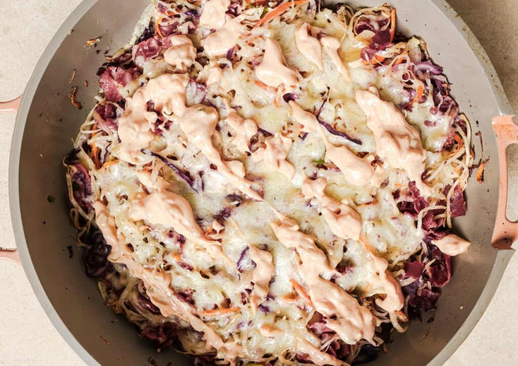 Reuben bowls in a skillet.