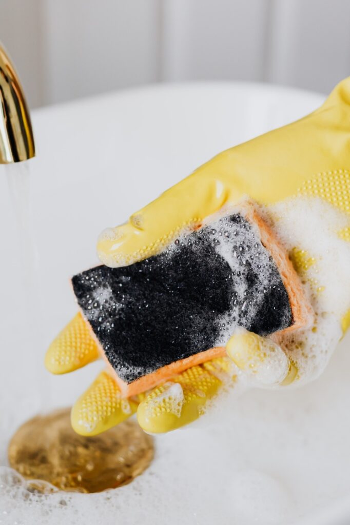 A soapy sponge over a sink.