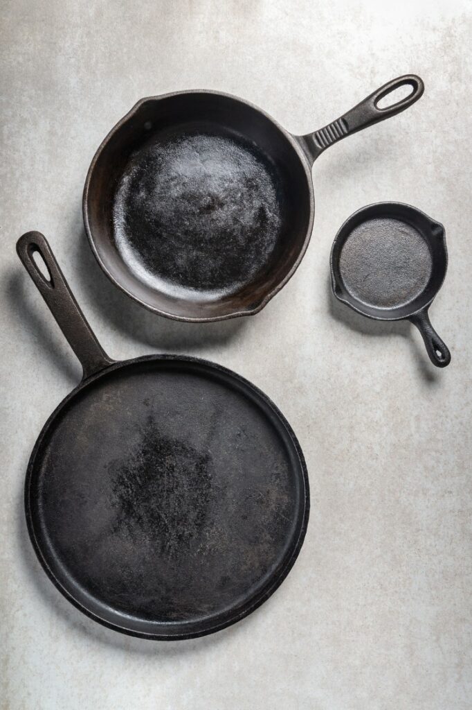 Three cast iron skillets.