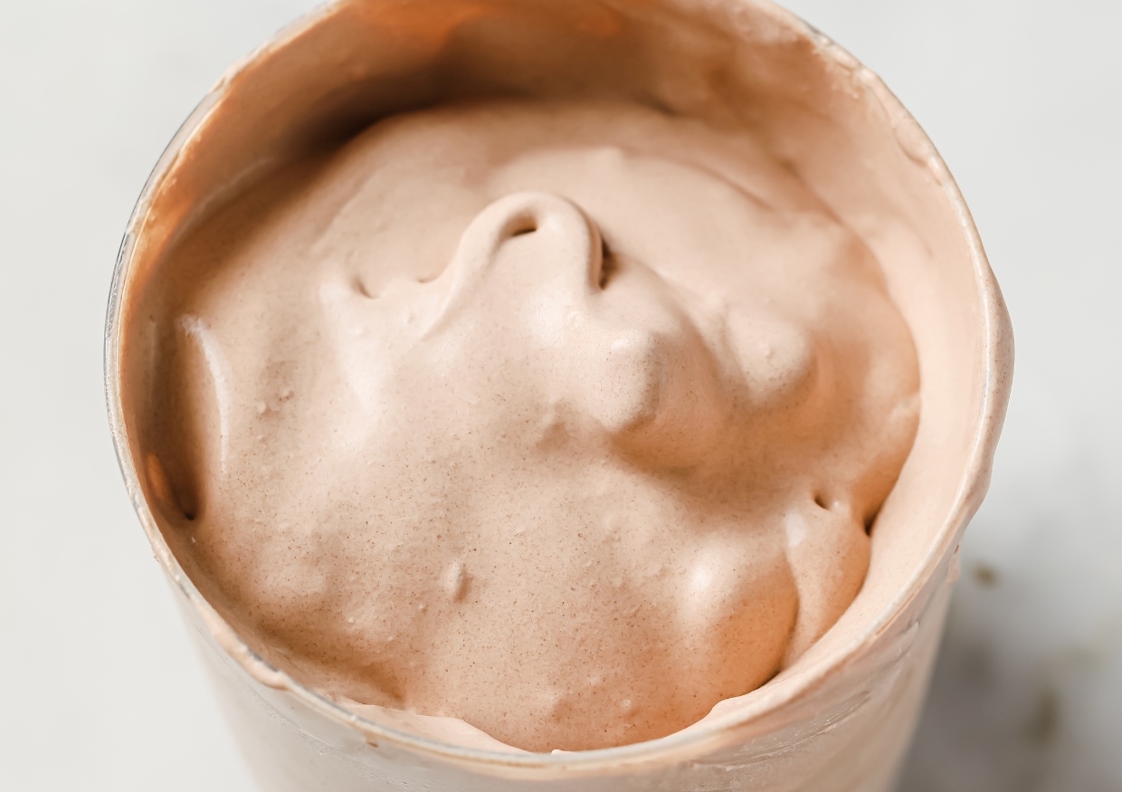 A glass of keto frosty on a countertop.
