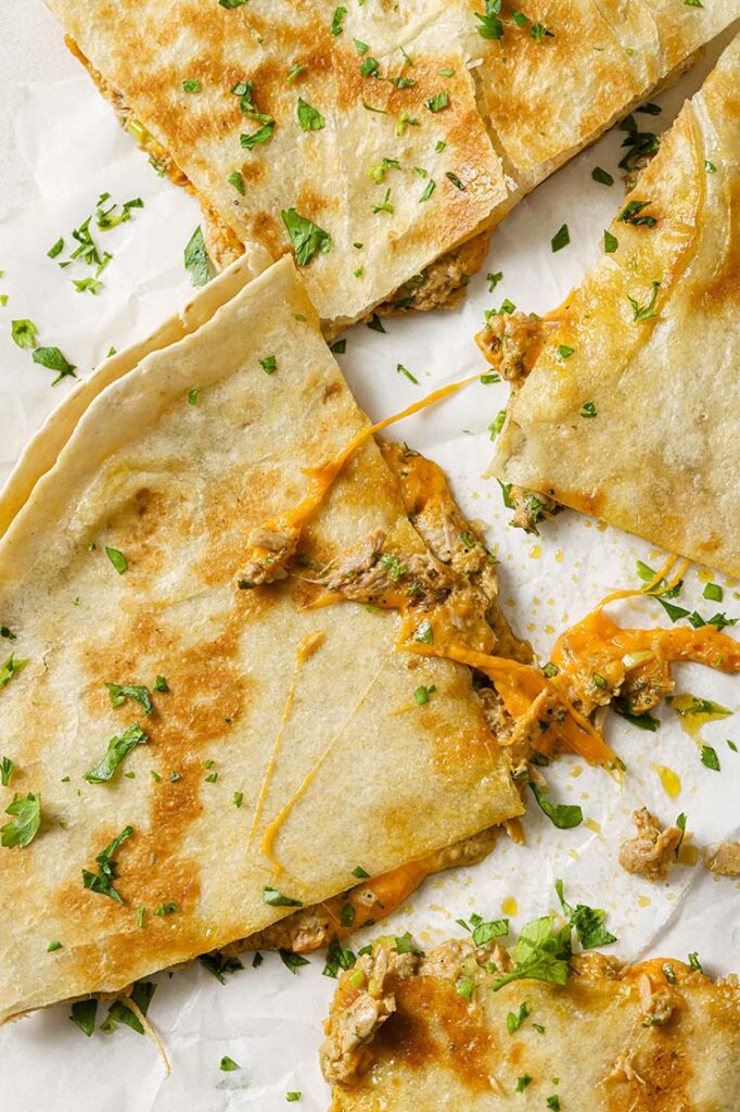 Garnished tuna melt quesadillas.