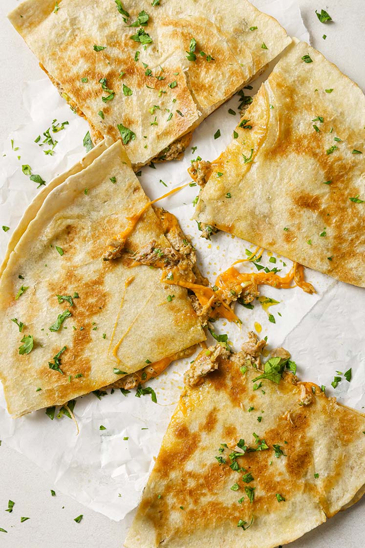 Garnished tuna melt quesadillas.