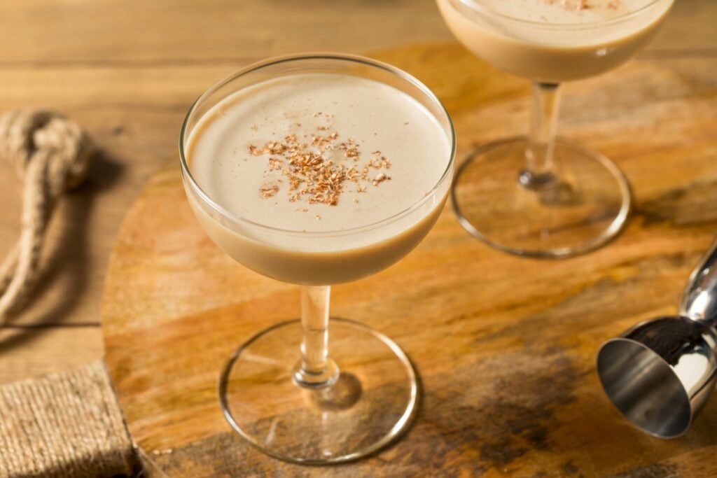 Brandy Alexander cocktails on a wood bar.