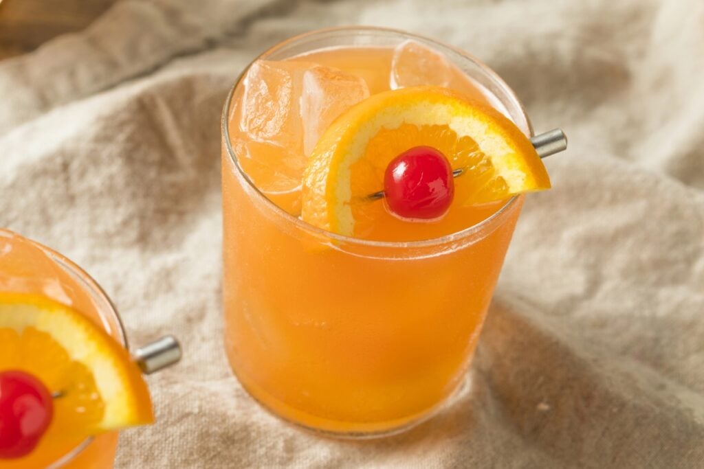 Ward Eight cocktail with a cherry and orange slice skewered.