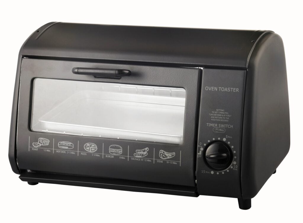 A black countertop oven toaster with a transparent door displaying various cooking modes and a timer switch. The controls and icons are printed in white on the front panel.