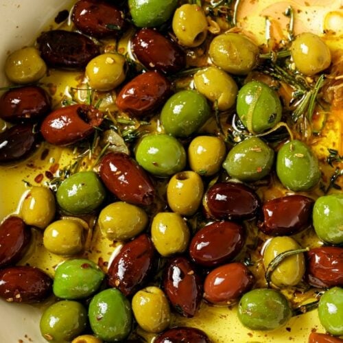 A pan of warm marinated olives.