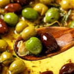 Pinterest graphic for the Warm Marinated Olives recipe.