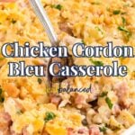 A hand holding a spoon scoops creamy Chicken Cordon Bleu Casserole from a white dish, topped with golden breadcrumbs and fresh parsley. Text overlay reads, "Chicken Cordon Bleu Casserole.