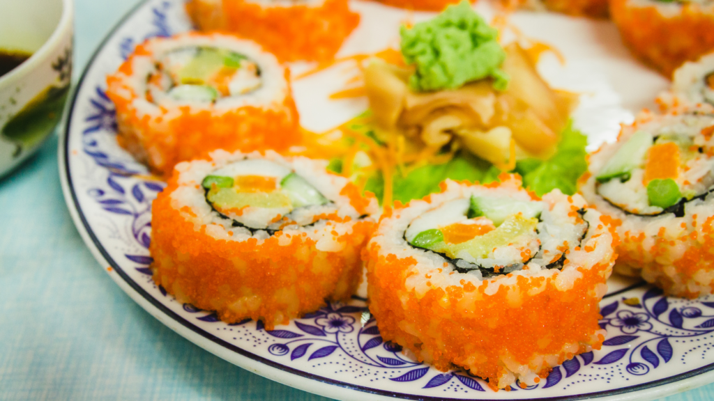 California sushi rolls topped with orange tobiko, served with wasabi, ginger, and dipping sauce.