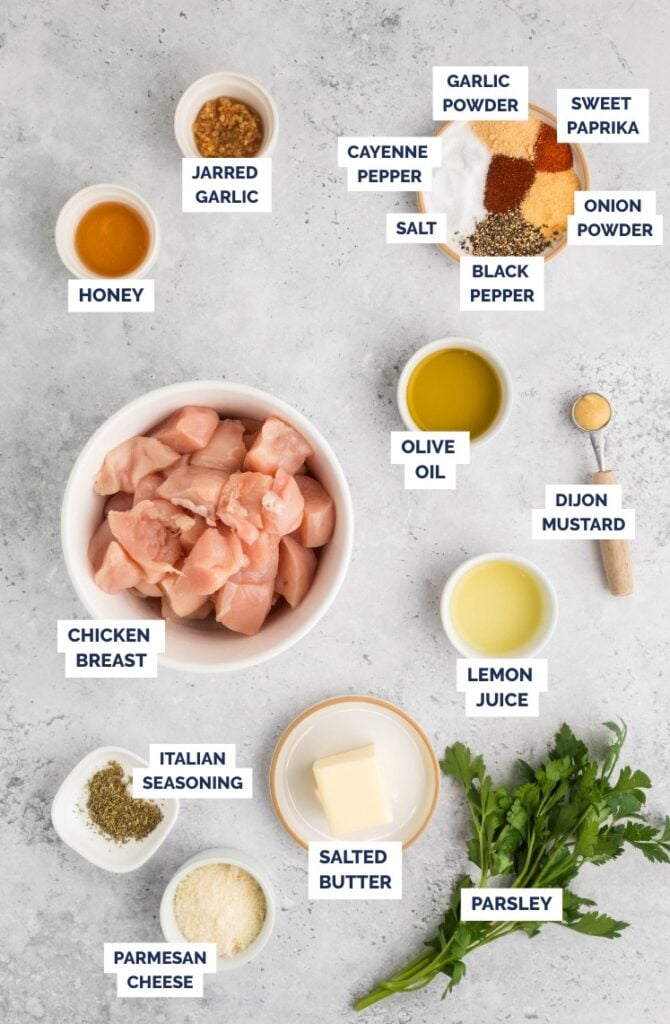 Air fryer chicken skewers ingredients laid out on a countertop.