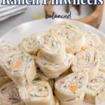 Chicken bacon ranch pinwheels stacked on a white serving platter with the recipe title displayed above.