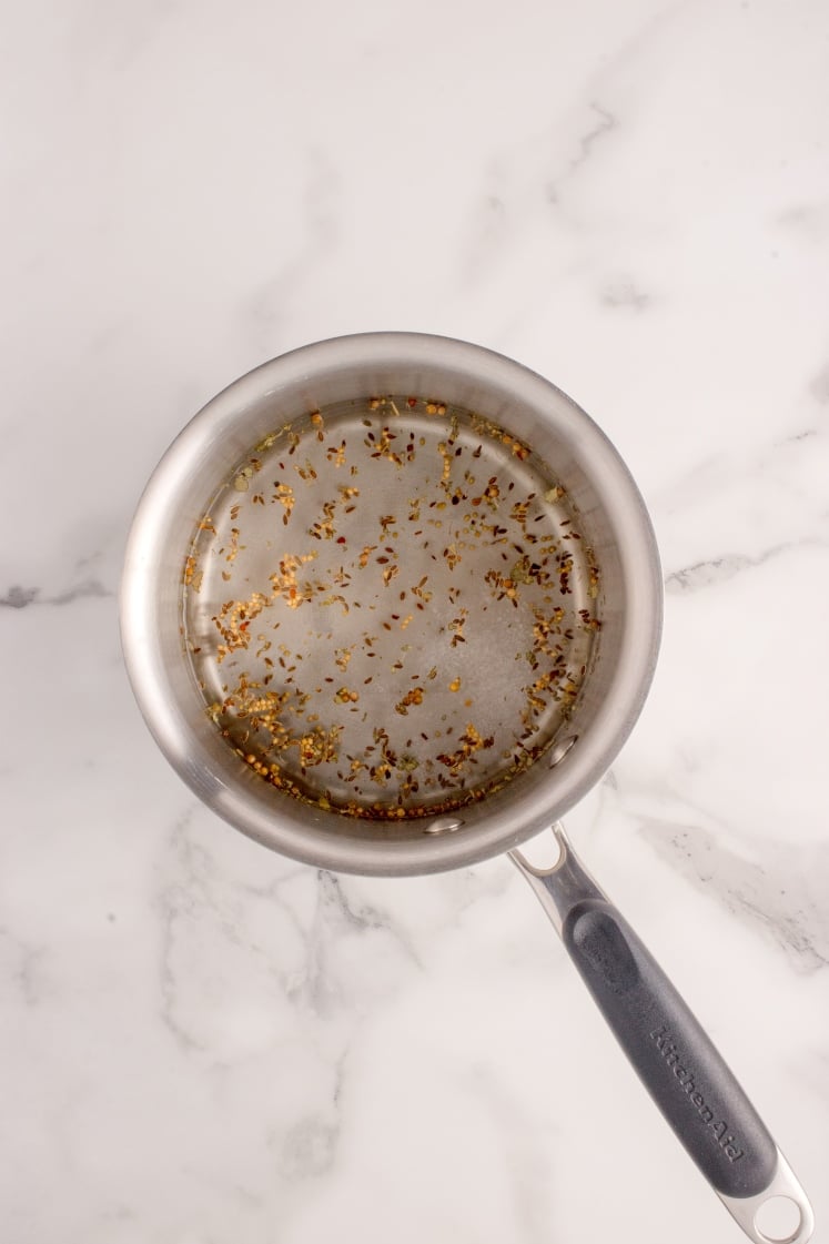 Pickling spices simmering in a saucepan.