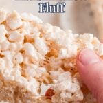 Hand holding a square of rice krispie treat made with marshmallow fluff, with more treats in the background. Text overlay reads "Rice Kripsie Treats with Marshmallow Fluff.