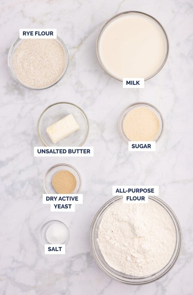 Flat lay of labeled ingredients for rye dinner rolls.