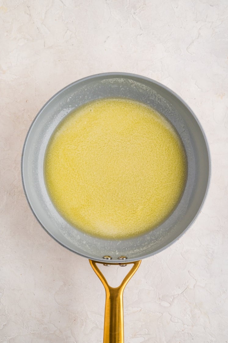 Melted butter in a skillet.