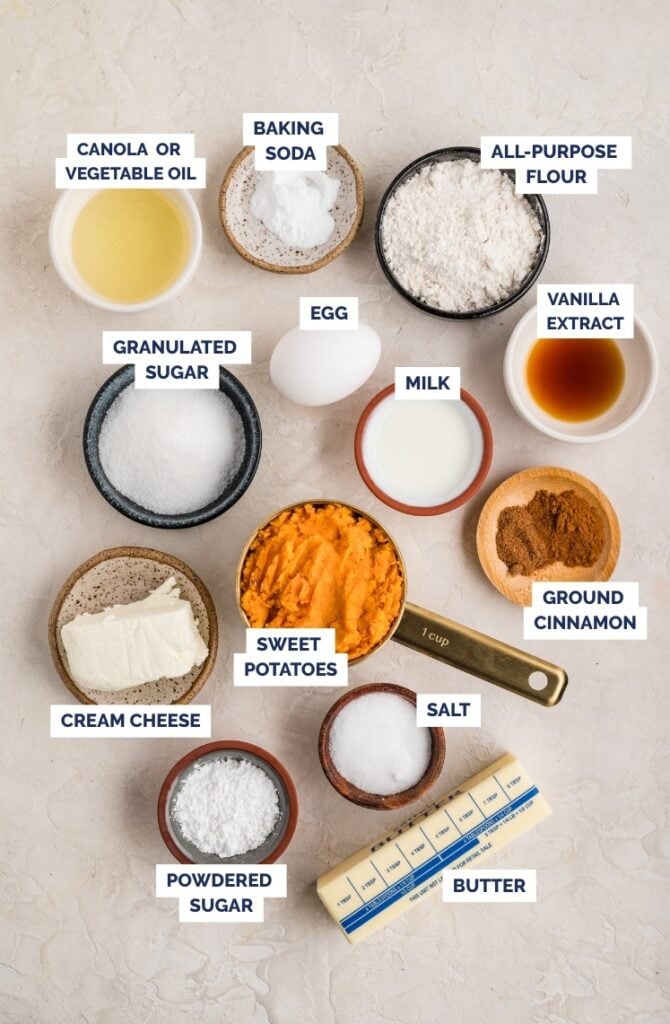 Ingredients for sweet potato loaf arranged on a light surface.