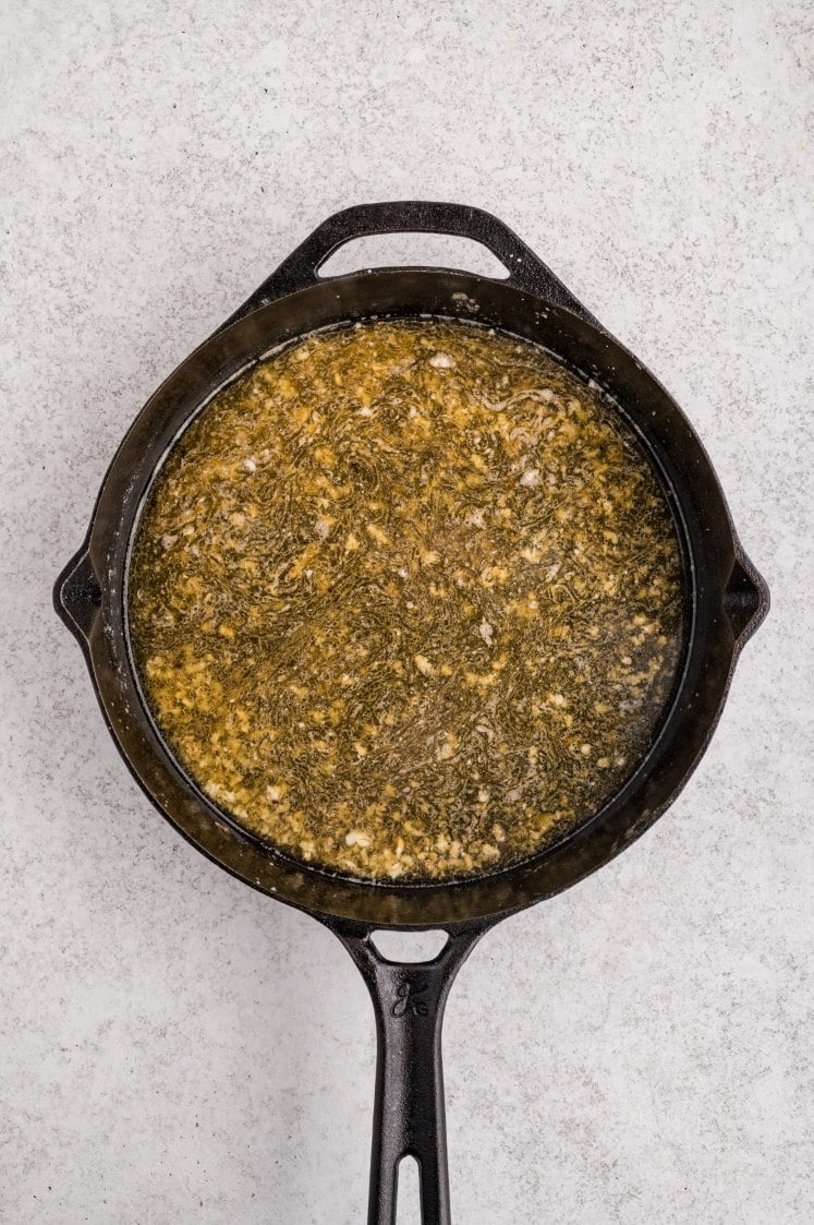 Garlic butter sauce simmering in a skillet.