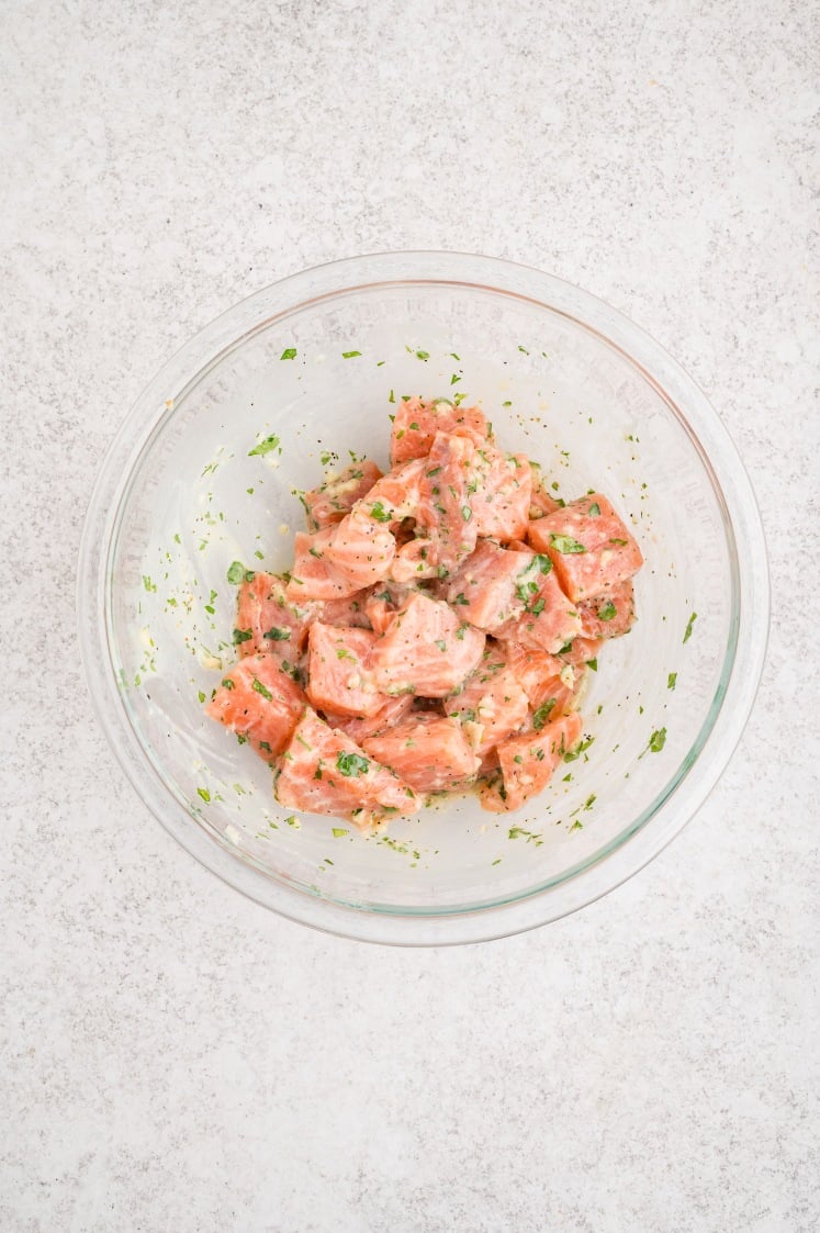 The salmon once it’s tossed in the marinade.