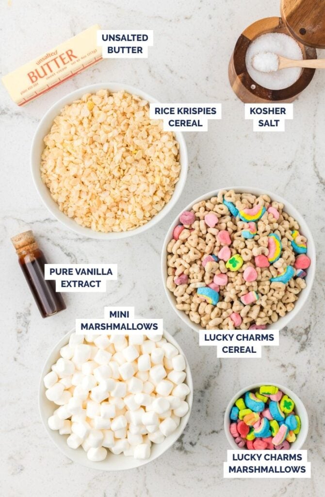 Ingredients for Lucky Charms Rice Krispies treats arranged on a surface.